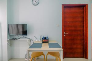 Cozy Stay 2BR Tamansari Mahogany Apartment By Travelio