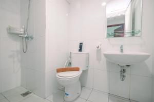 Cozy Stay 2BR Tamansari Mahogany Apartment By Travelio