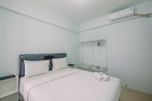 Cozy Stay 2BR Tamansari Mahogany Apartment By Travelio