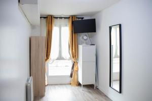 Appartements Cosy Home - PantinSmile : photos des chambres