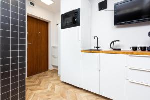 Affordable Underground Micro Apartment Grochowska by Noclegi Renters