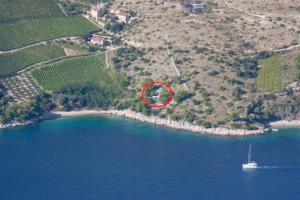 A small stone house by the sea, in a wineyard
