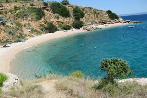 A small stone house by the sea, in a wineyard