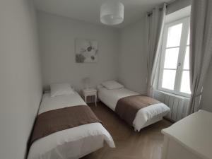 Appartements Les Charmilles : photos des chambres