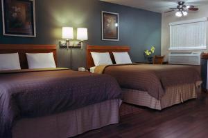 Queen Room with Two Queen Beds room in Maple Leaf Motel