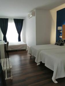 Superior Triple Room with Sea View room in Hotel Llorca