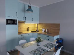 Apartamenty z tarasami "Miętowy spokój 15" "Romantyczna szarość 16" "Niebieska elegancja 17" maksymalnie dla 6 osób