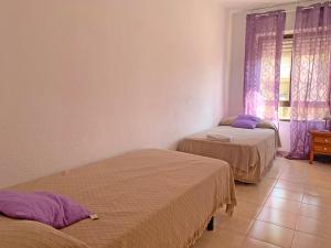 Three-Bedroom Apartment room in Apartamentos Playa del Cargador 3000