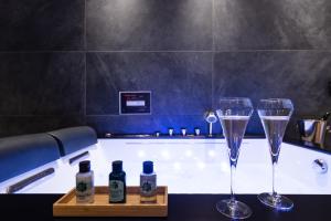 Appartements Le SPA & L'Alcove - Jacuzzi - Sauna - Appart'Hotel SPA - Melina & Alfred : photos des chambres