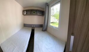 Campings Mobil home climatise 6 personnes dans camping 3* Tohapi a BOOFZHEIM : photos des chambres