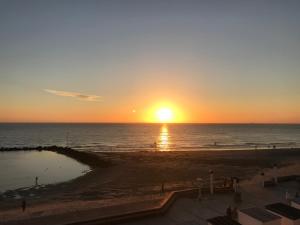 Appartements Le coucher de soleil - face mer avec terrasse : photos des chambres