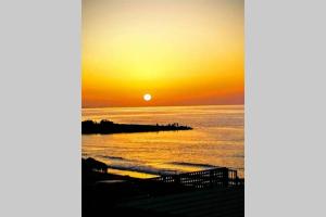 Flokos. Lazy days, balmy nights on the seafront Heraklio Greece