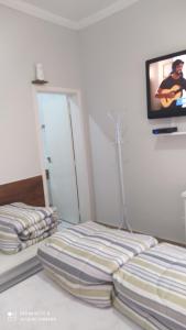 Pousada Quarto Familiar com ar,frigobar,wi fi, garagem