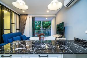 Apartment at Palmyrah Surin by Lofty