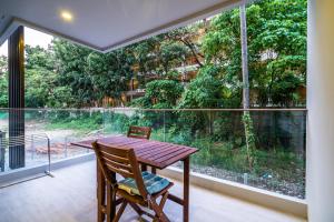 Apartment at Palmyrah Surin by Lofty