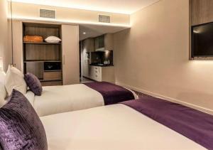 Deluxe Twin Room room in Leva Hotel and Suites, Mazaya Centre