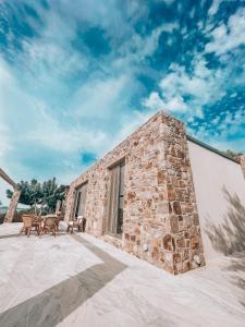 Stone built house next to the beach Ammouliani Greece