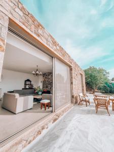 Stone built house next to the beach Ammouliani Greece