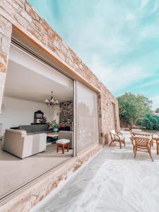 Stone built house next to the beach Ammouliani Greece