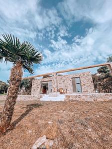 Stone built house next to the beach Ammouliani Greece