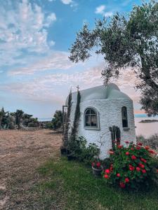 Stone built house next to the beach Ammouliani Greece