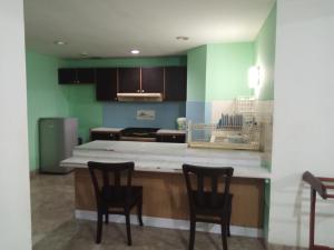 PENGINAPAN KONDOMINIUM CARITA - PAK BoS