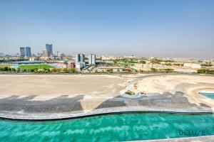 Sunny 1BR at Canal Residences West Dubai Sports City by Deluxe Holiday Homes