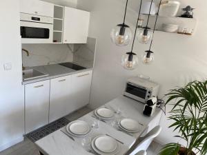 Appartements La Fleur Marine Classe 3 etoiles - Acces direct mer Cabourg : photos des chambres