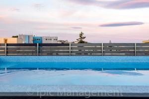 Spacious 2BR Apartment with Rooftop Pool & Large Terrace