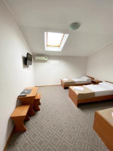 Economy Quadruple Room room in Ural Hotel