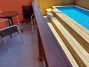 Mamanguá - Apto c piscina, 50mts da praia, cozinha, churrasqueira, ar con, WiFi, netflix, garagem