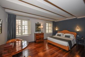 Junior Suite Deluxe room in The Tuscanian Hotel