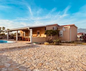 Beautiful secluded area near Novalja vacation house with pool and sea view Villa Lara