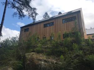 An Caisteal Lodge with cascading waterfall view