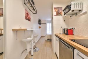 Appartements Paris Gare du Nord en 15 min - Studio Le Rosier - : photos des chambres