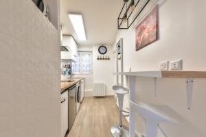 Appartements Paris Gare du Nord en 15 min - Studio Le Rosier - : photos des chambres