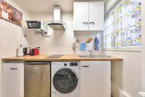 Appartements Paris Gare du Nord en 15 min - Studio Le Rosier - : photos des chambres