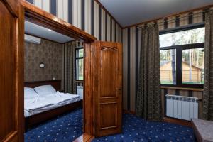 One-Bedroom Suite with Sofa Bed room in Carivka Hotel