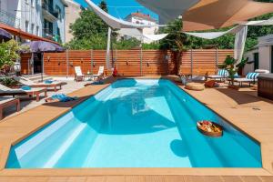 Evala luxury rooms with pool and garden