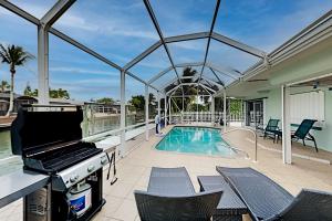 Four-Bedroom House room in Canal-Front Retreat - Private Pool - Walk to Beach home