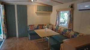 Campings Chalets met buitenkeuken op Camping Lei Suves - JoyCasa : photos des chambres