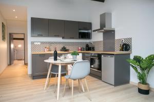 Appartements Logis des Halles du Coderc : photos des chambres