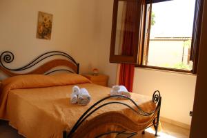 Casa Vacanze Libeccio - Villetta con giardino e piscina condominiale