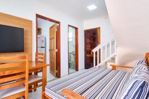 Apartamento bem equipado com ar condicionado e churrasqueira a 100 metros da praia - 02 dormitórios - Edifício Água Viva