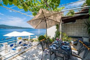 One-Bedroom Apartment with Terrace and Sea View room in Apartments Ratac Lobrović with private beach and beautiful sunset