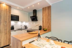 Apartamenty w sam las by KLIF Ustka - apartament na parterze z tarasem i parkingiem