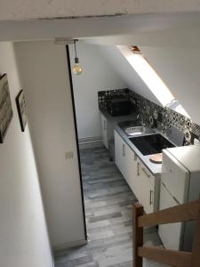 Appartements LA MANSARDE - AU COEUR DE LA VIEILLE VILLE : photos des chambres