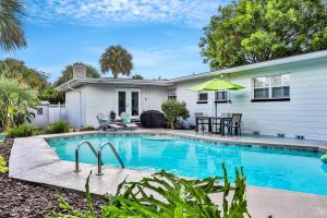 Beach house & backyard oasis with private pool - short walk to beach