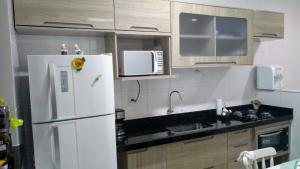 Lindo apartamento em prédio de frente para o mar