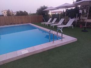 Holiday home next to orange tree orchard